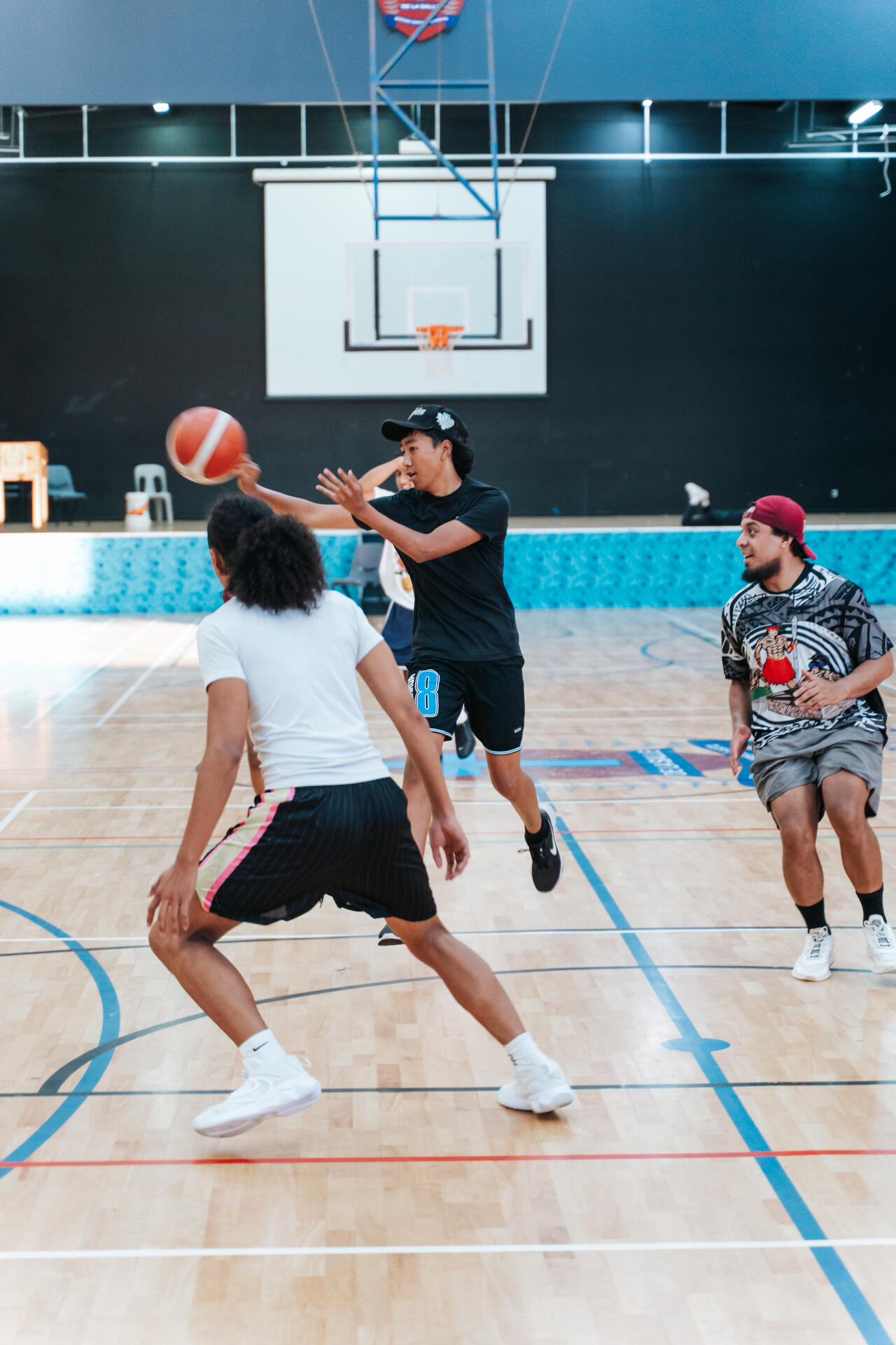 Basketball players in fast-paced game action