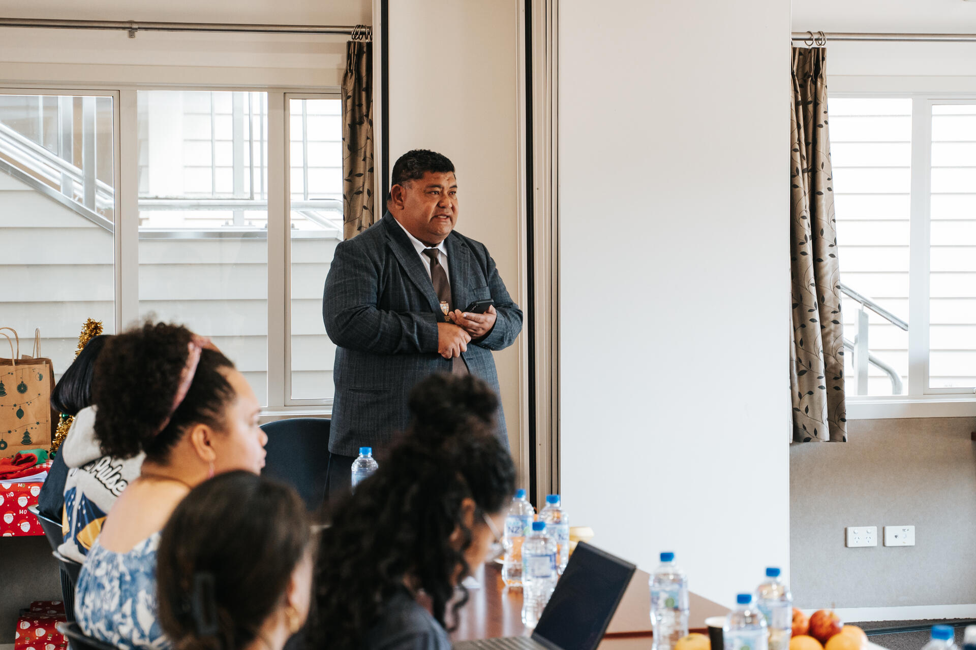 Iutana presenting at community meeting