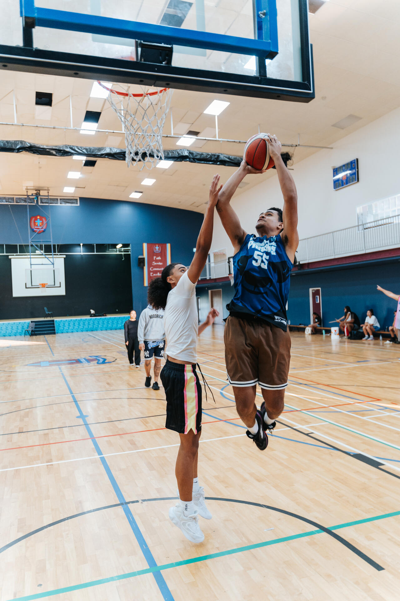 Basketball layup during youth game