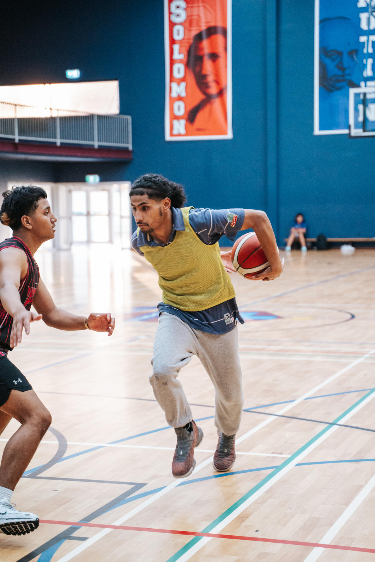 Youth basketball player driving to the hoop