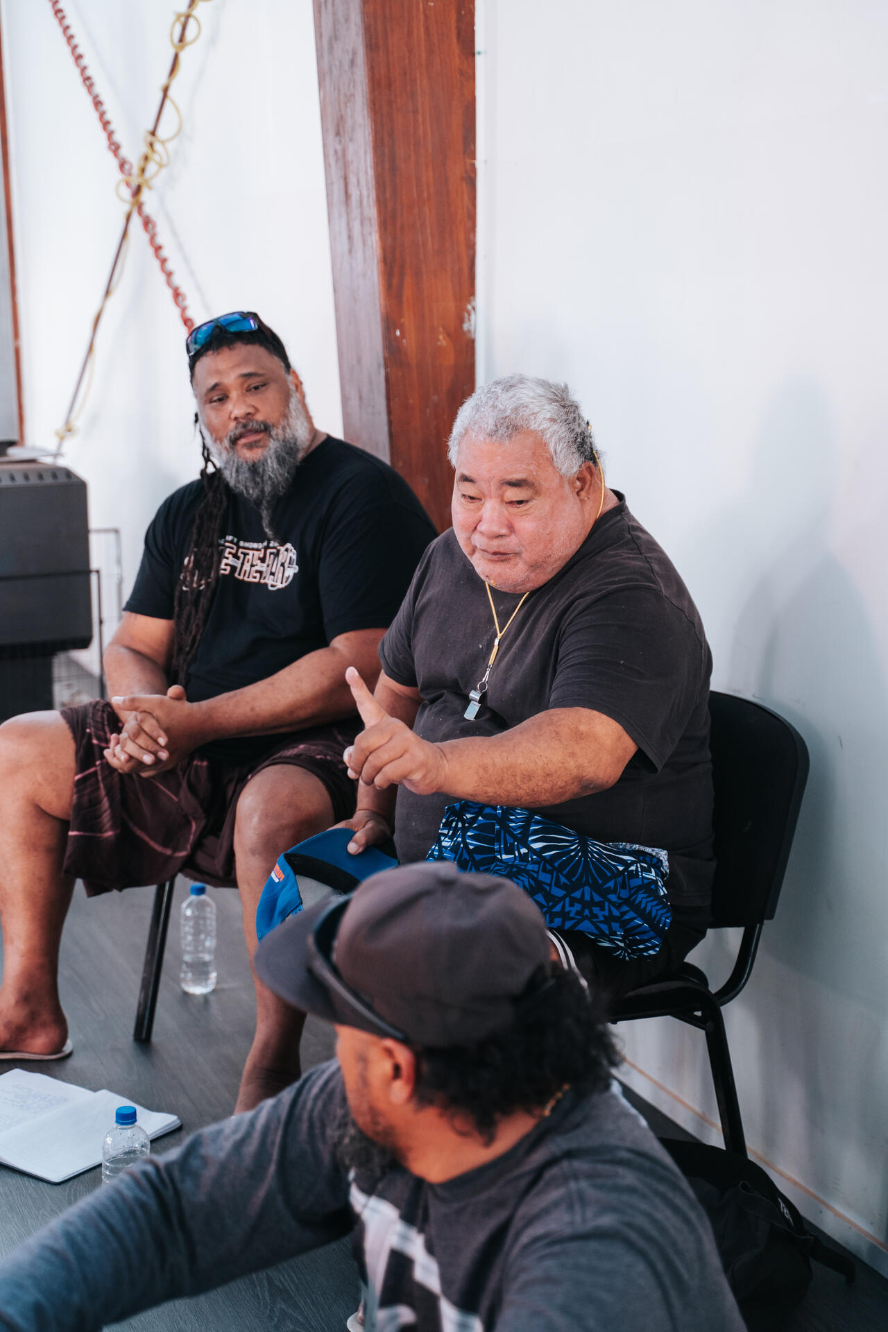 Community elders in discussion at meeting