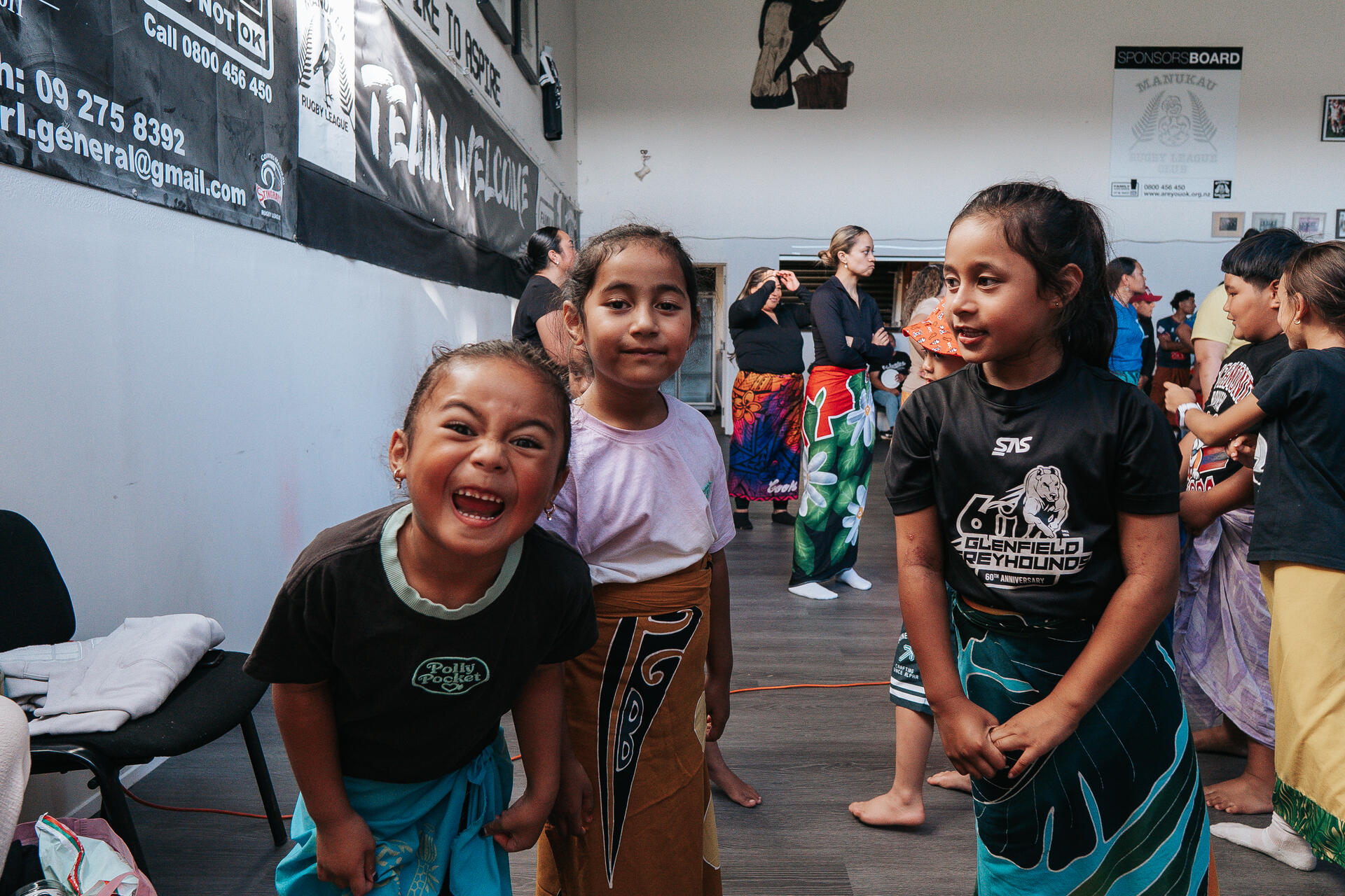 Children smiling at community event