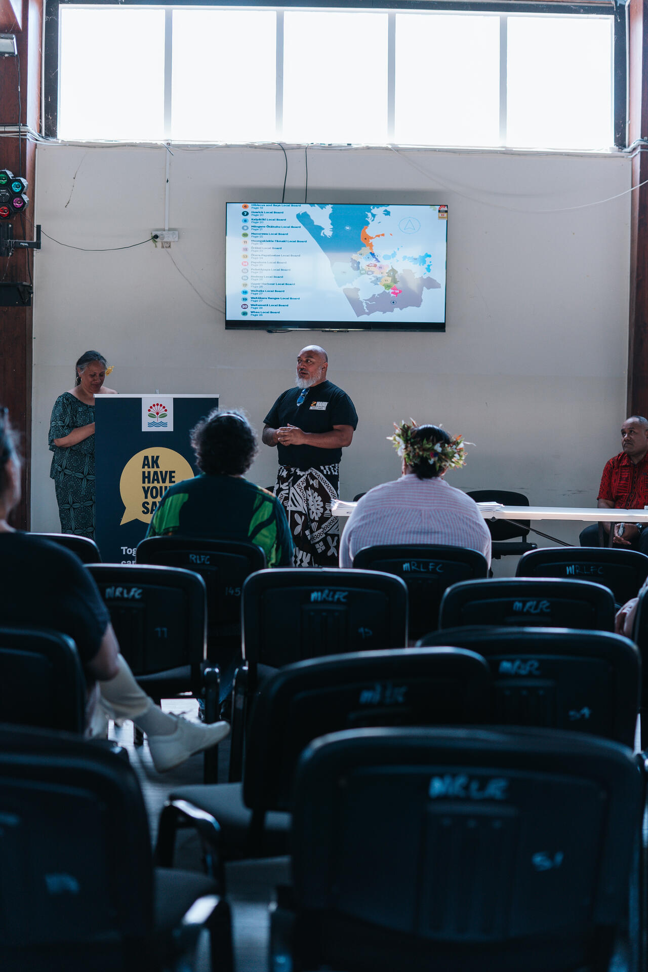 Presenter showing Auckland map at community consultation