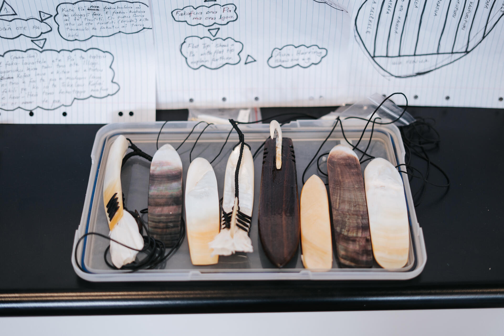 Traditional Tokelauan shell pendants and Pa carvings on display
