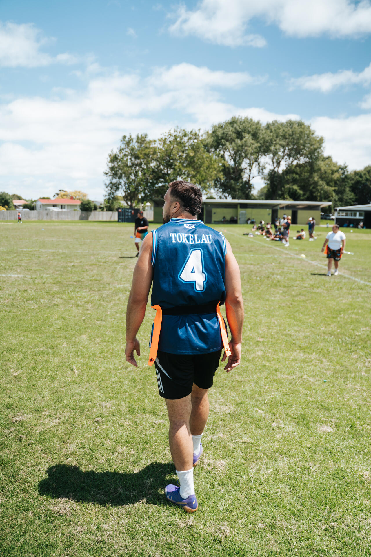 Tokelau player walking on the sports field wearing number 4 jersey