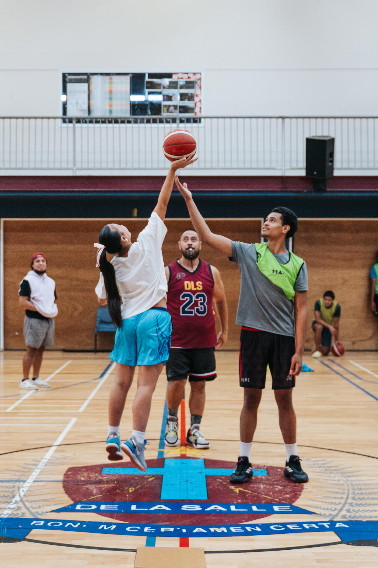 Basketball tip-off at indoor court