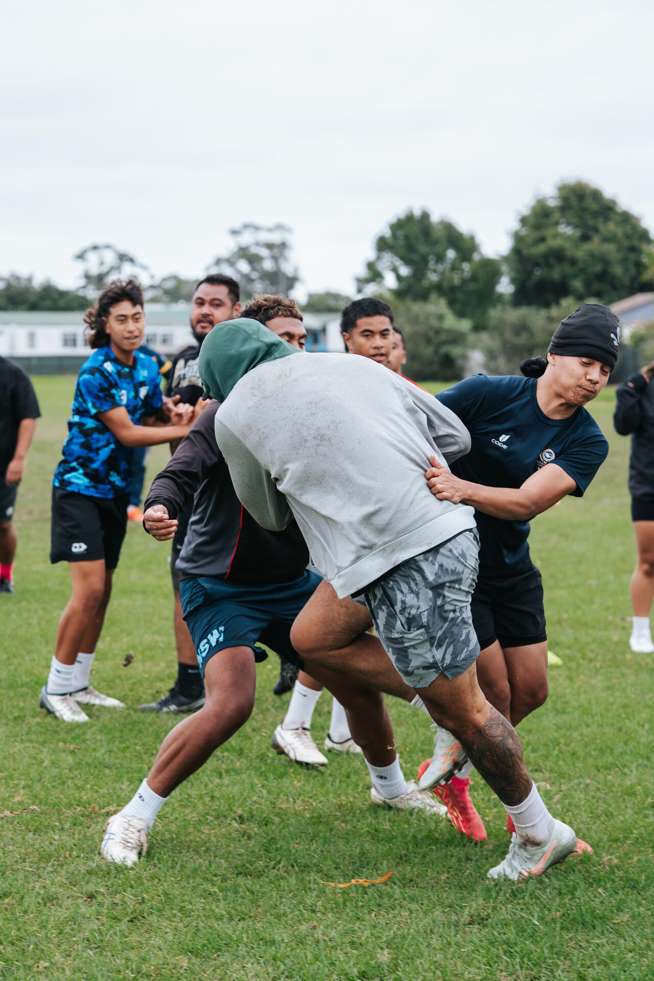 Youth rugby players competing on the field